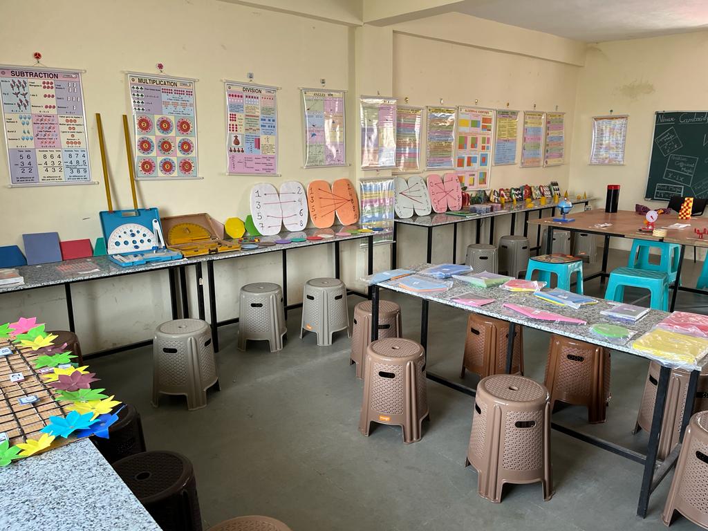 Spacious and well-lit classroom at Udaan Academy with proper seating arrangement and natural lighting for comfortable learning environment